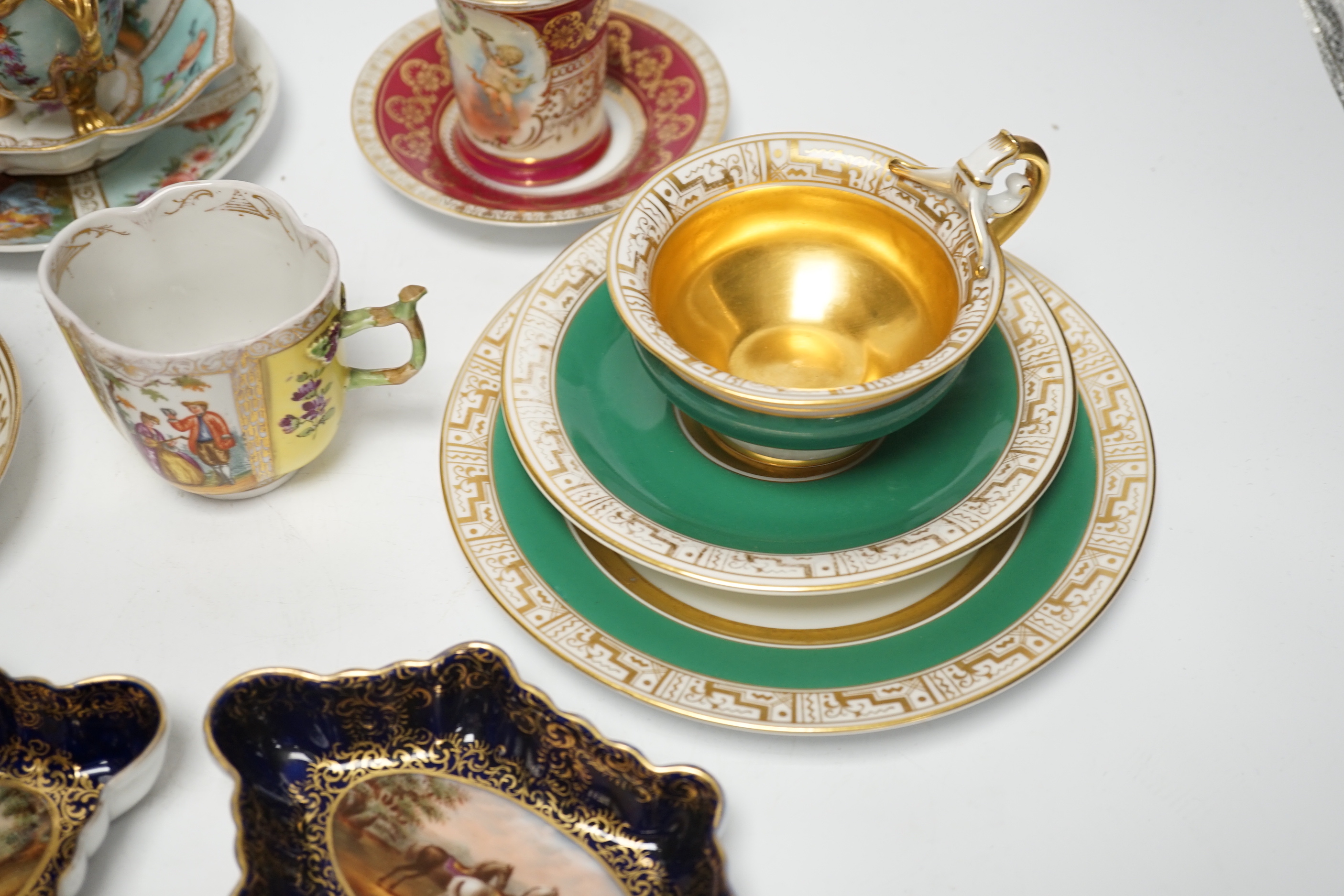 An Austrian chocolate cup and saucer, a similar trio, a BFB Worcester cup and saucer, a pair of spoon trays, etc. , spoon trays 15.5cm wide (14)